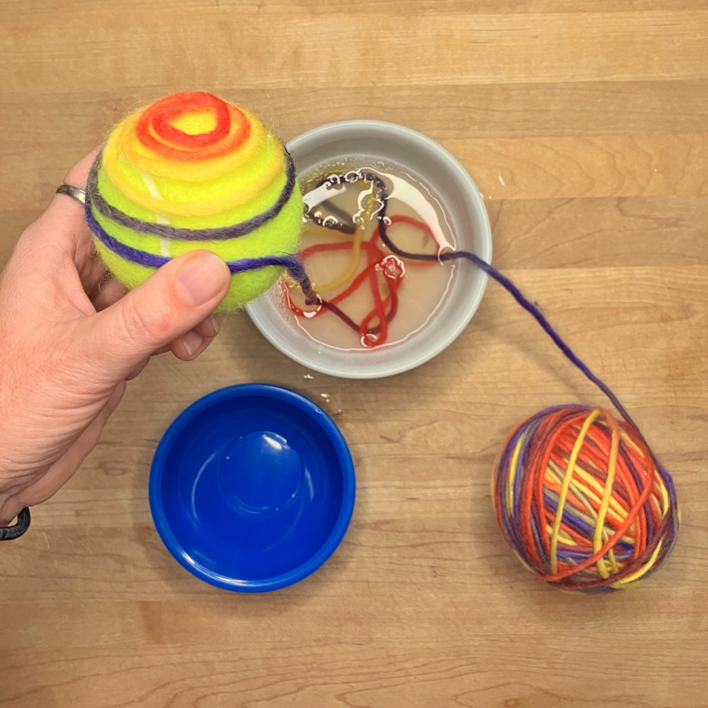 Soaking yarn and wrapping it around a tennis ball