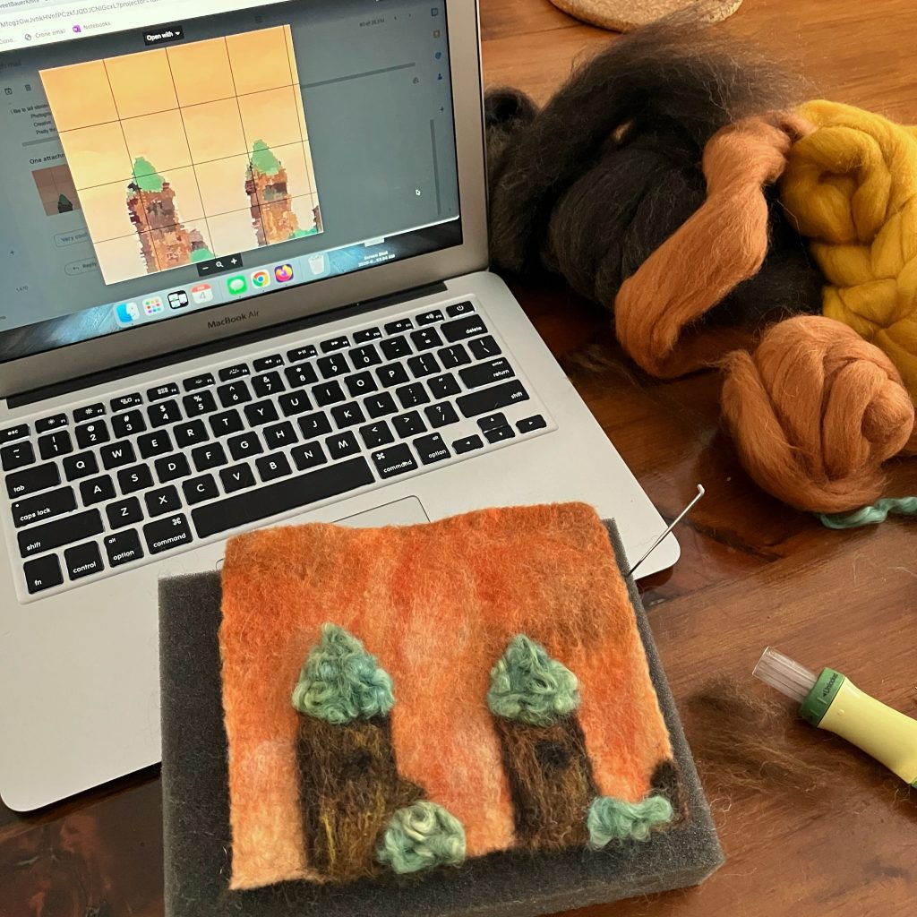 A felt square in the foreground looks at least a little bit like the image on the laptop in the background
