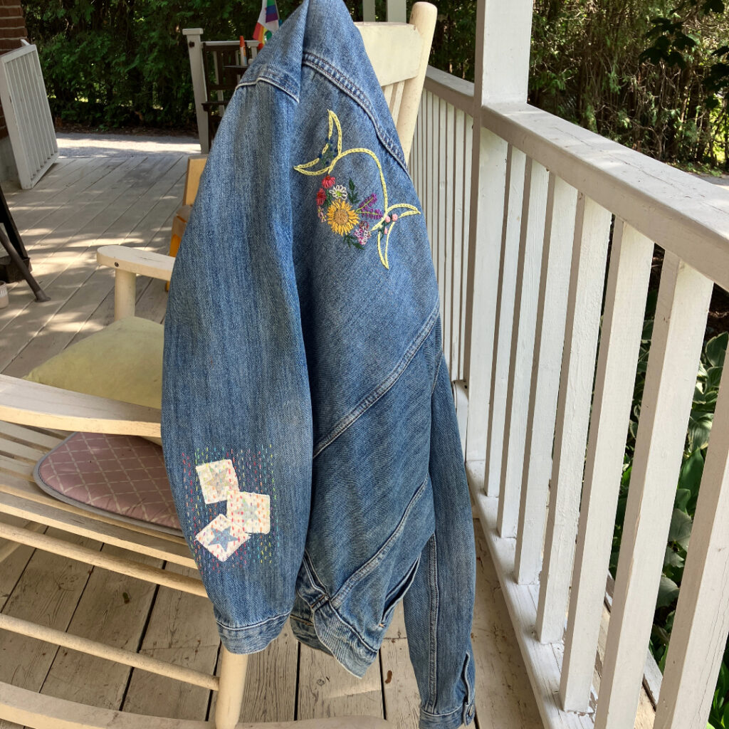 embellished and embroidered denim jacket on a chair