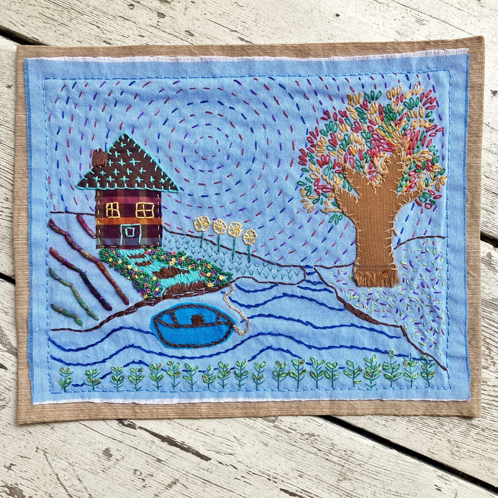 Embroidery landscape made with textile scraps