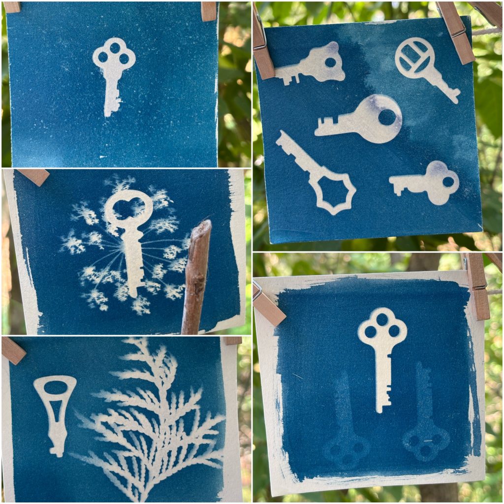 Deep blue cyanotypes of white keys in various compositions hang on a line with small clothespins