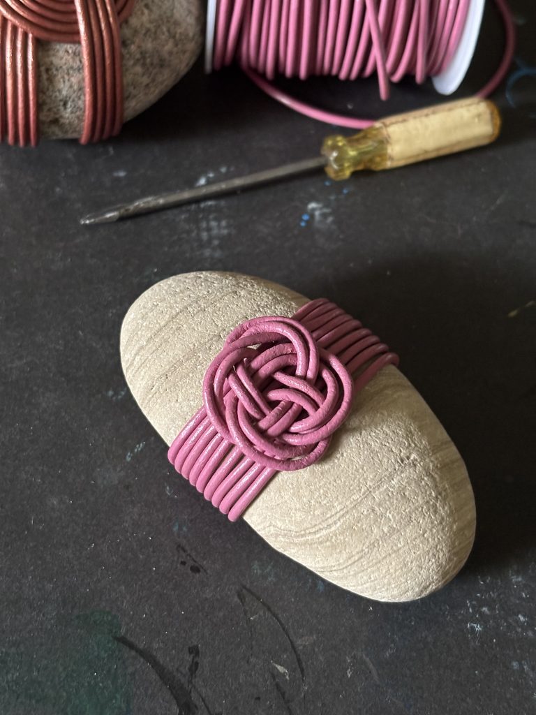 A sandstone rock with a carrick bend mat rock wrap