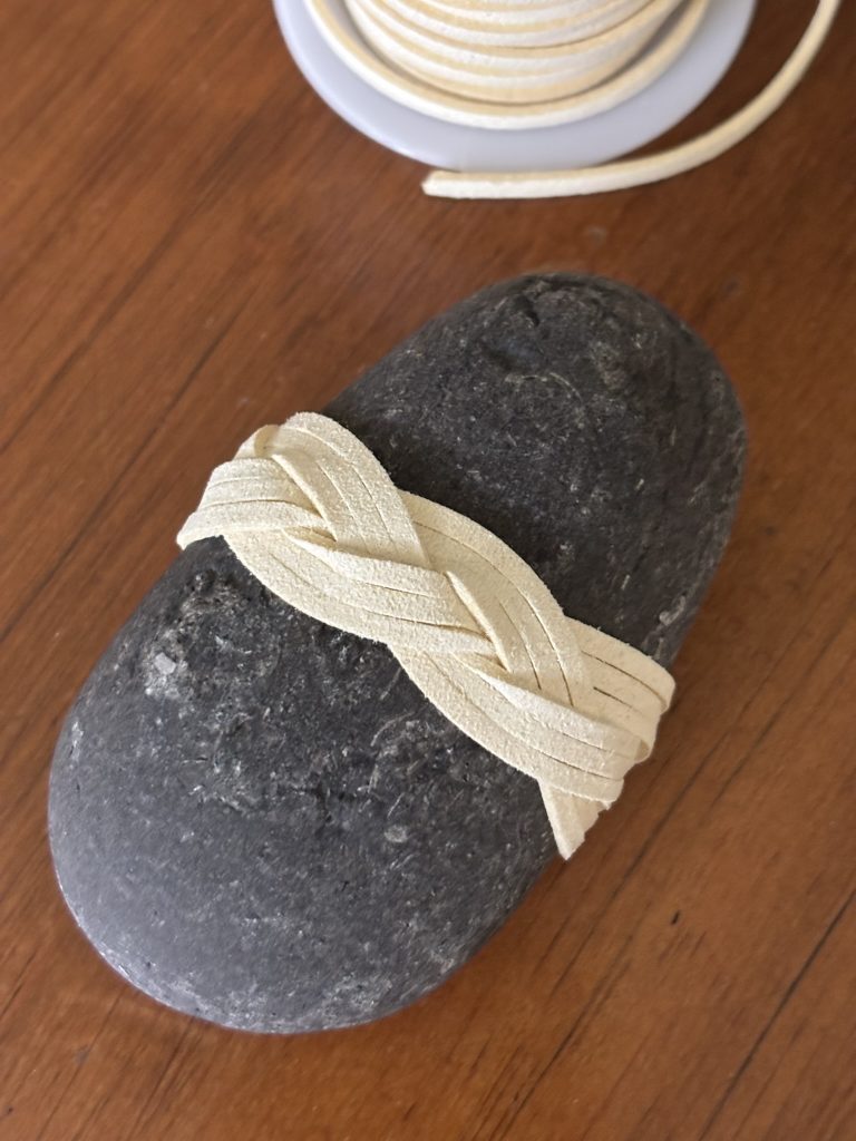 A rock wrapped with a Turk's Head Woggle