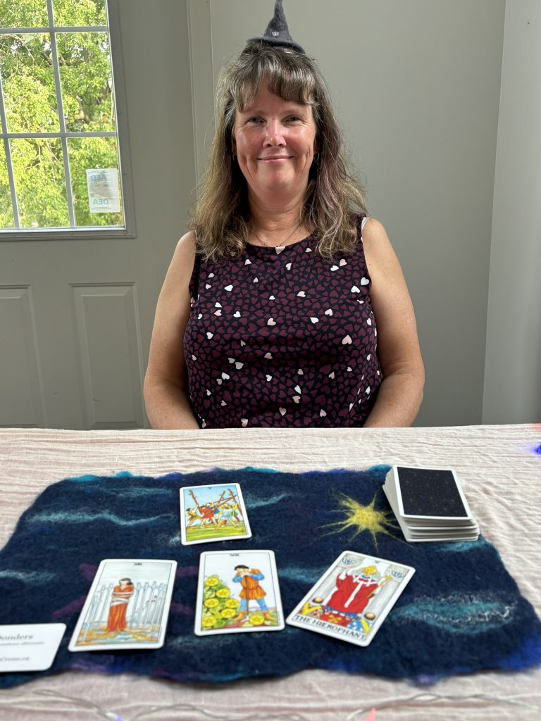 Dani reading tarot cards at a bridal shower