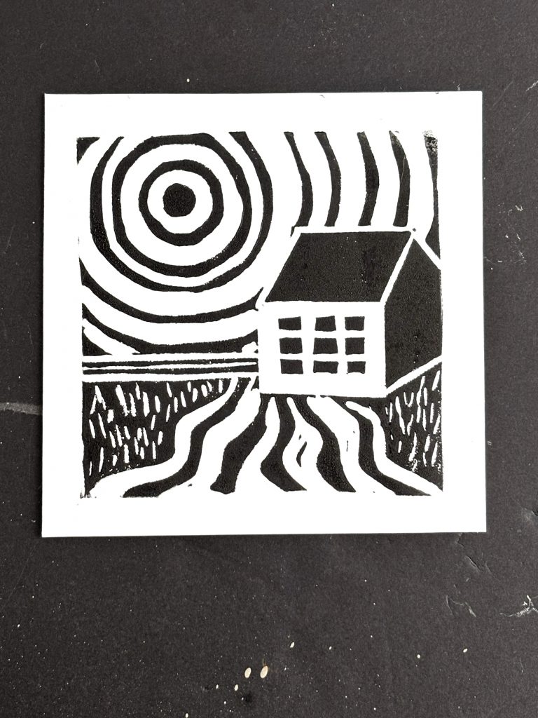 Three images showing the progression of making a drawing of Watson's Mill, carving the drawing and making a block print of it