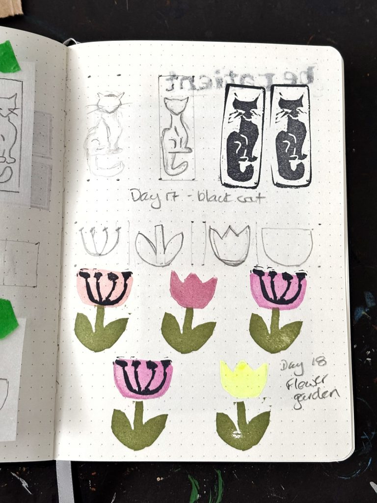A notebook showing carved pink eraser stamps and the preliminary drawings and sketches