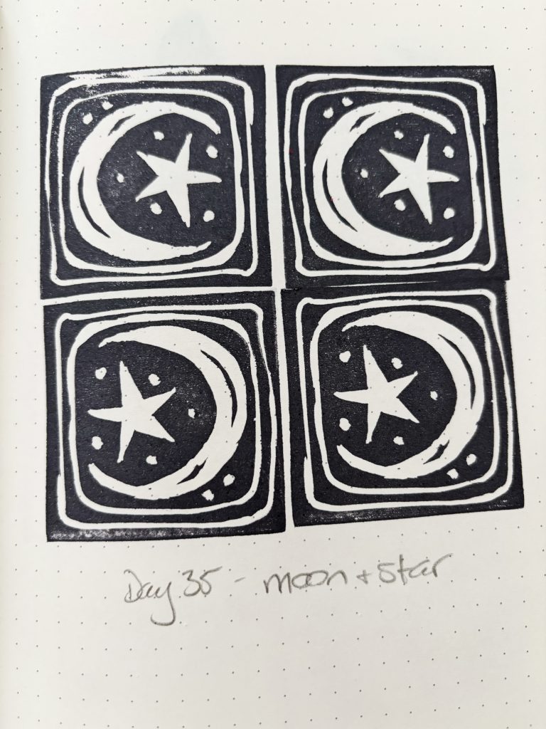 Playing with carving, inking and printing 2x2 inch linocut stamps. This one is a moon and star.
