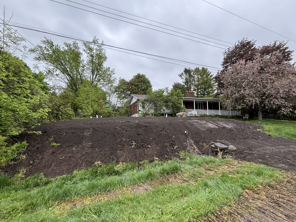 After shot showing a larger slope on the ditch, elevated property and no more trees